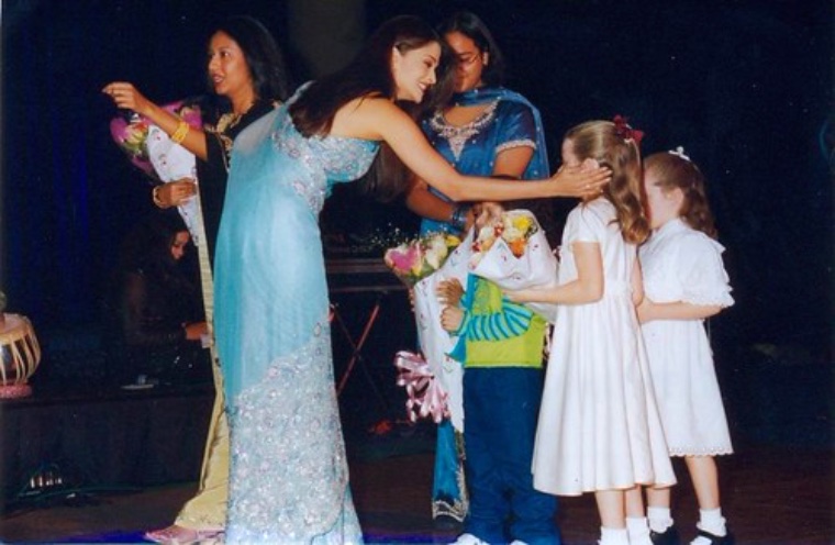 A parent and child celebrating together